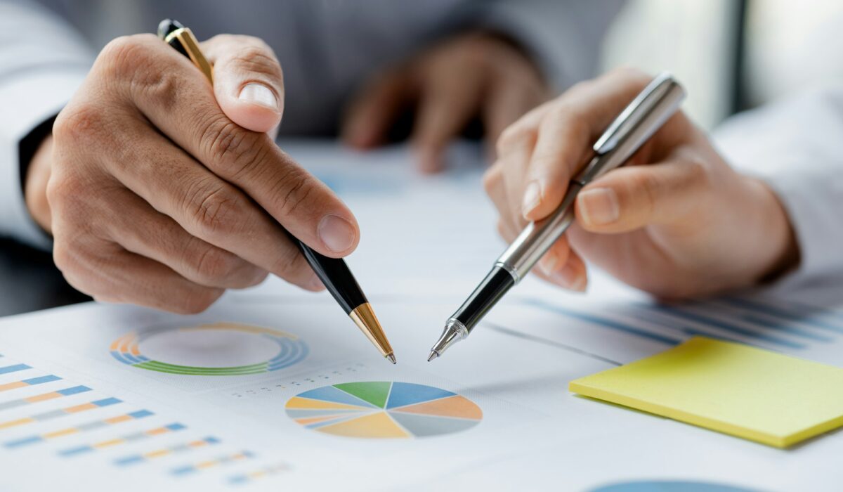 Company meeting room has businessmen and finance managers meeting together on finance topics.